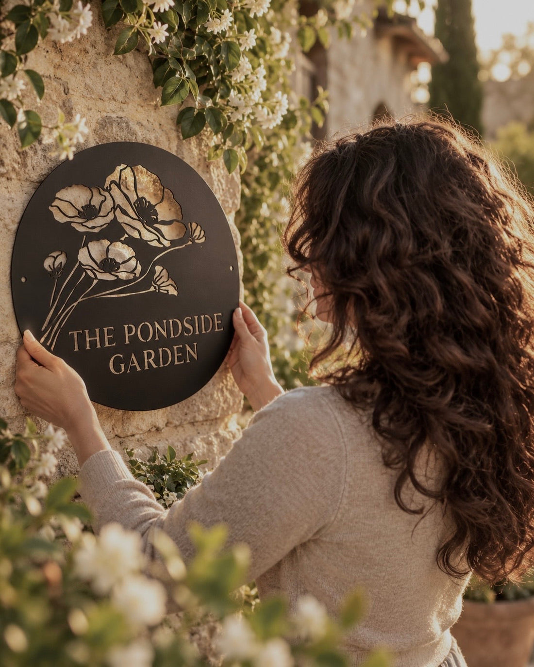 Personalized metal garden name sign shown as an example of naming a garden